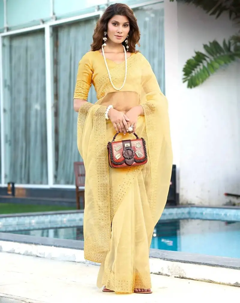 Yellow embroidery sequin border work organza saree