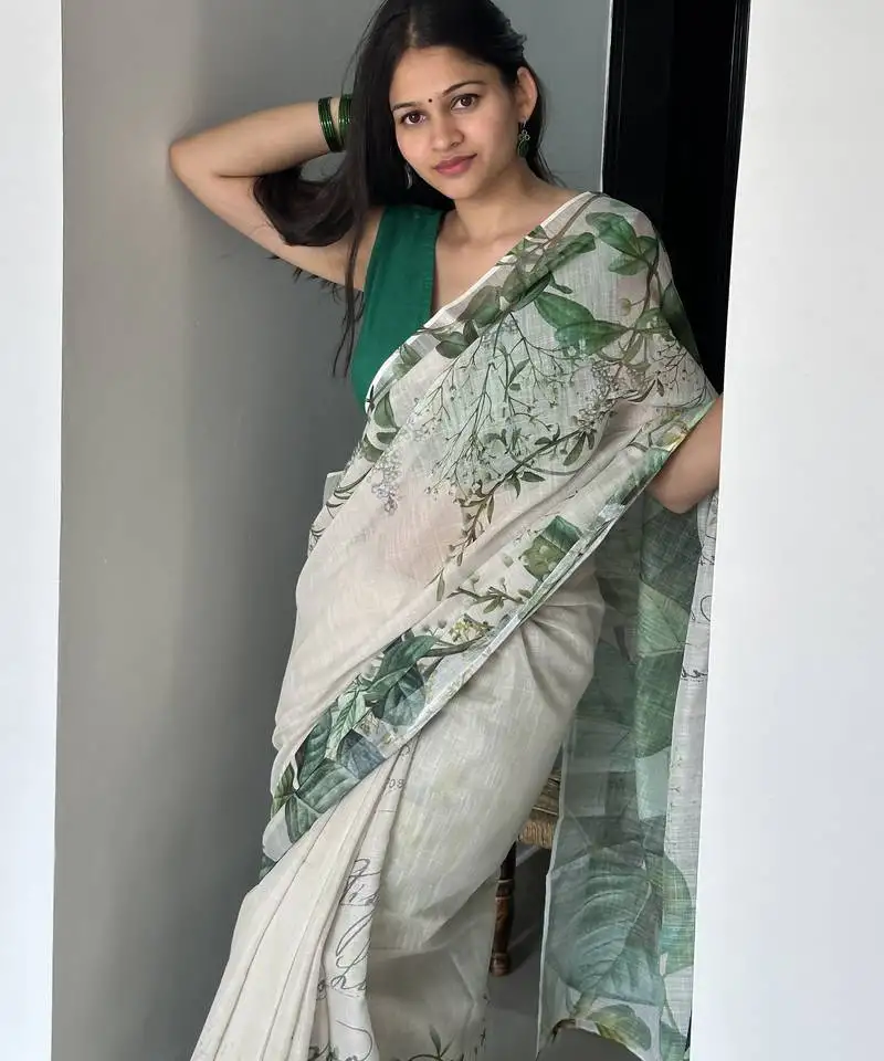 Green tropical printed soft linen saree with handmade tassels and printed blouse