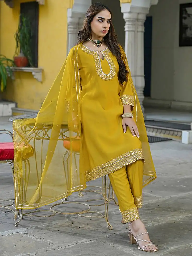 Women mustard silk blend solid embroidered a-line kurta trousers with dupatta