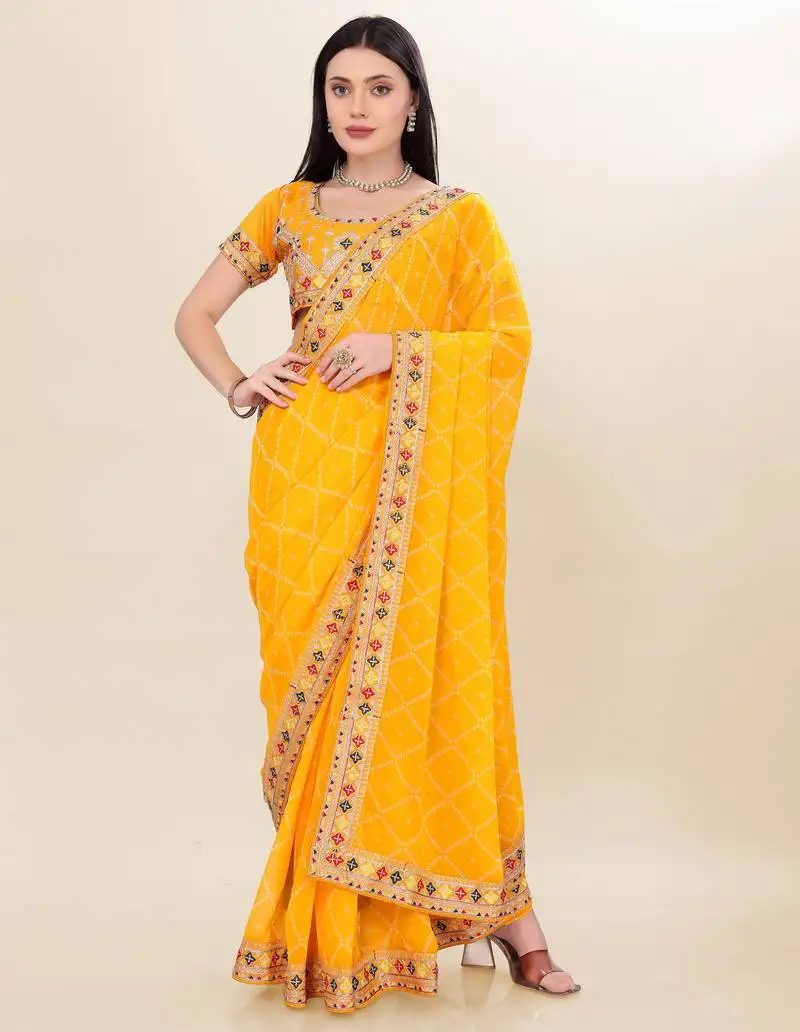 Yellow georgette bandhej printed saree with embroidered work