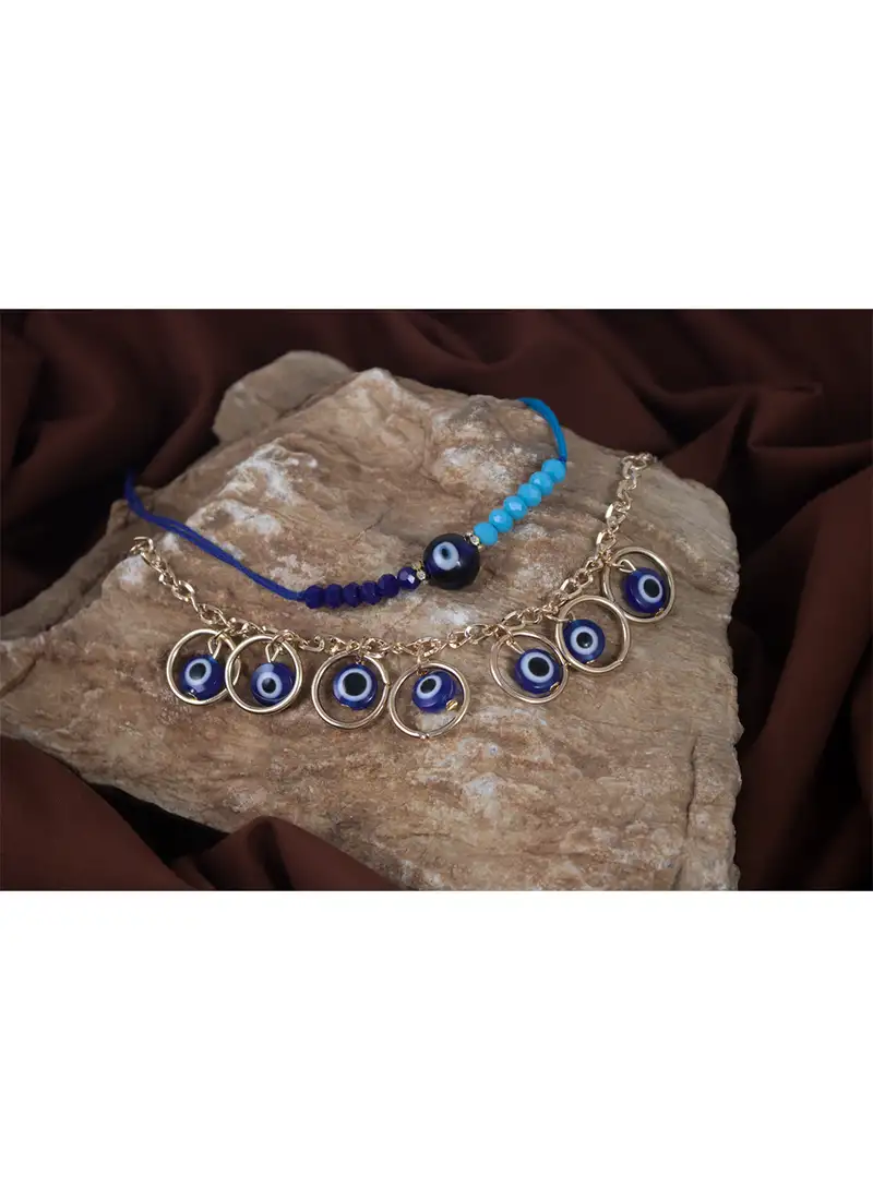Handcrafted combo of evil eye protective rakhi for bhaiya bhabhi with roli chawal and written greeting note.