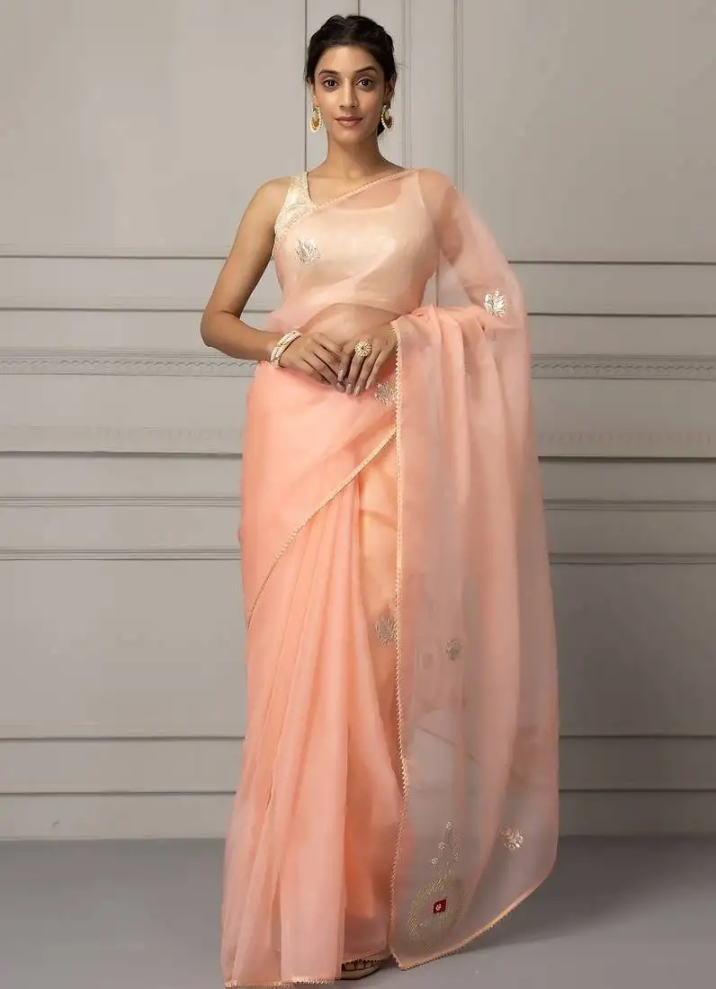 Peach-coloured embellished organza saree
