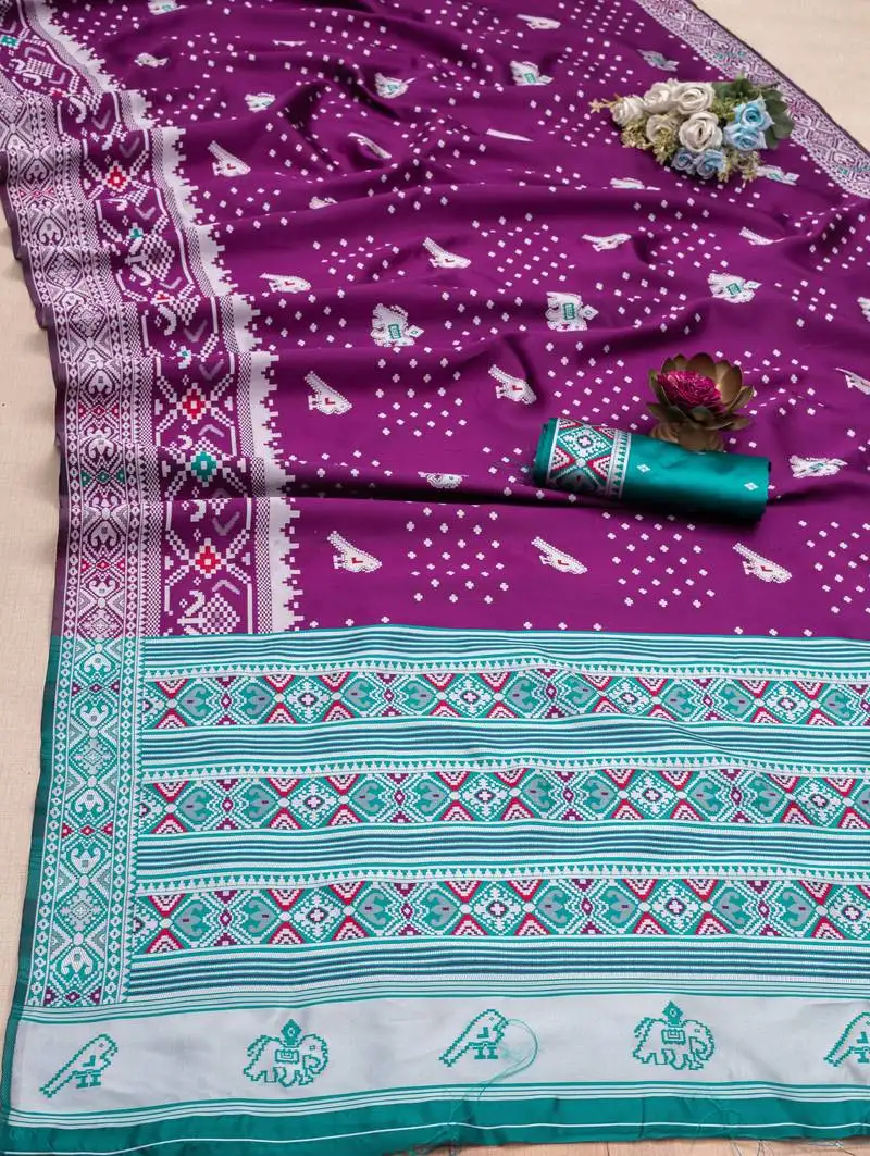 Purple soft litchi silk blend saree with traditional motifs and finished with a luxurious zari pallu