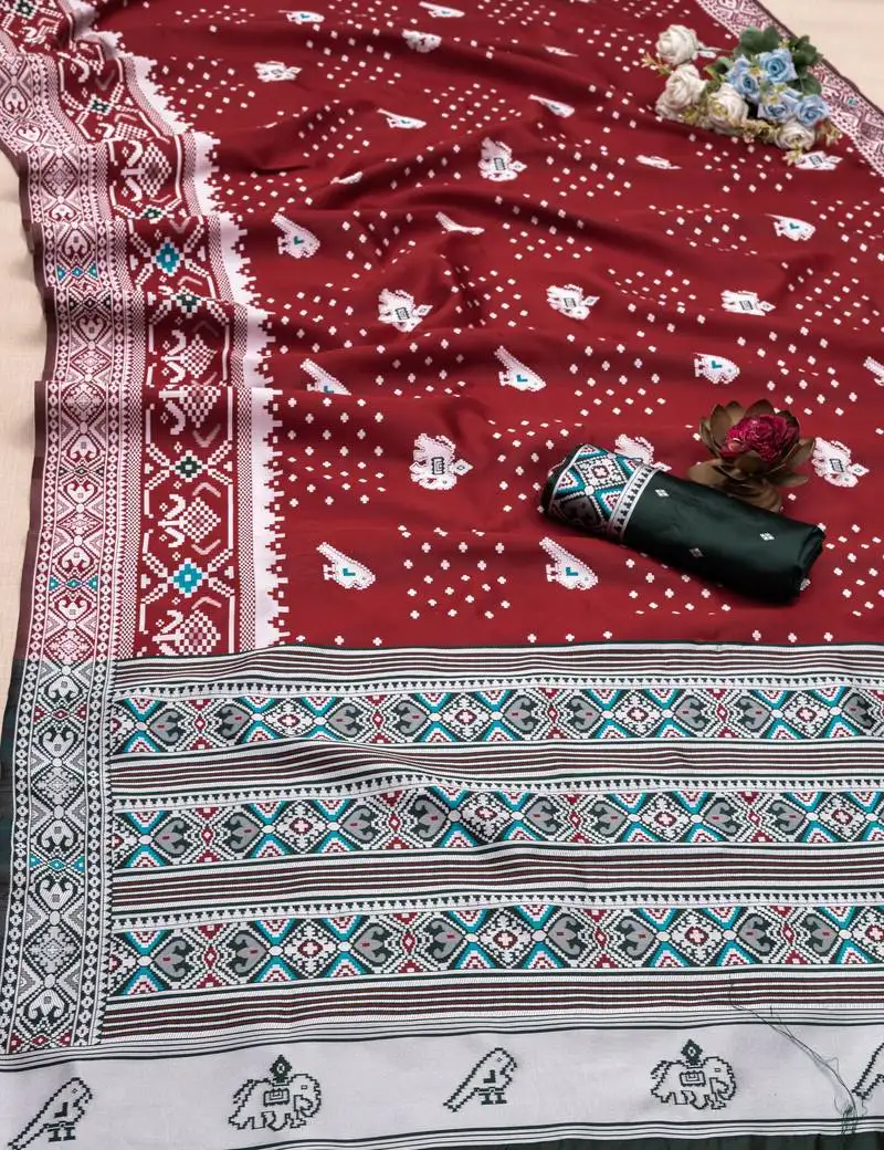 Red soft litchi silk blend saree with traditional motifs and finished with a luxurious zari pallu