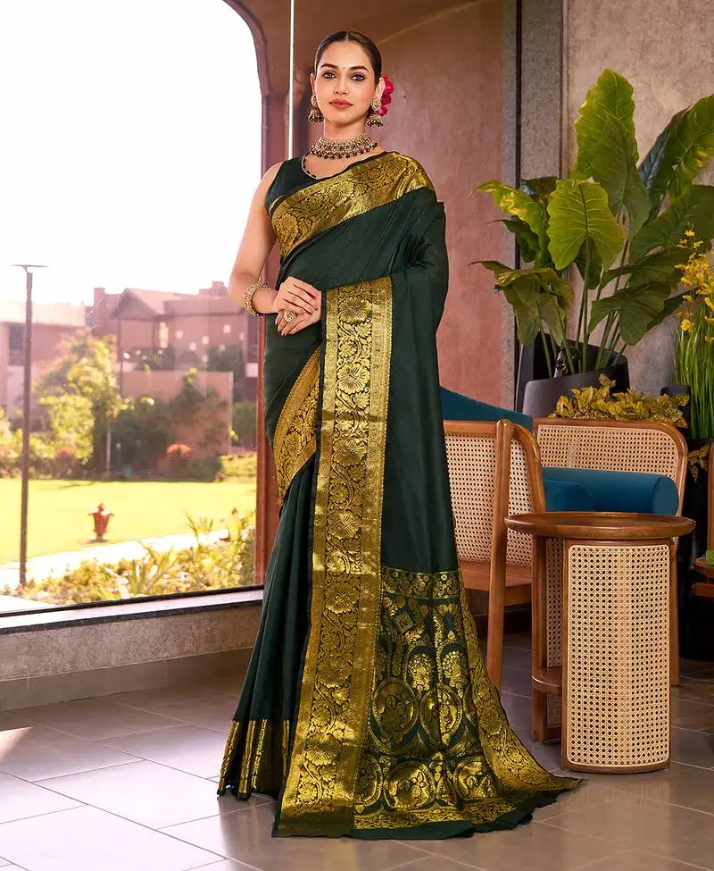 Dark green woven kanchipuram style saree with blouse piece