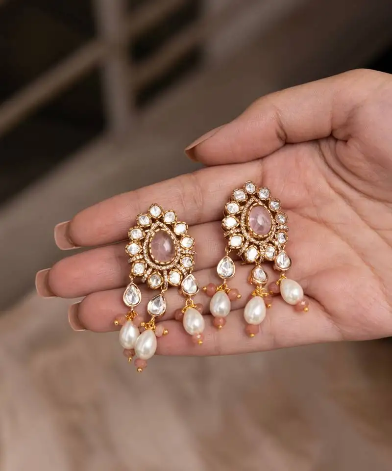 Gold plated pink stone dangler earrings