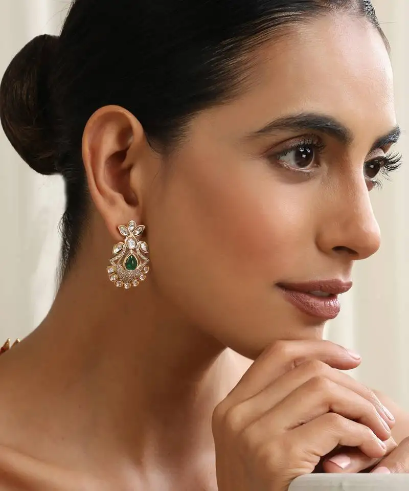 gold plated green stone kundan earrings