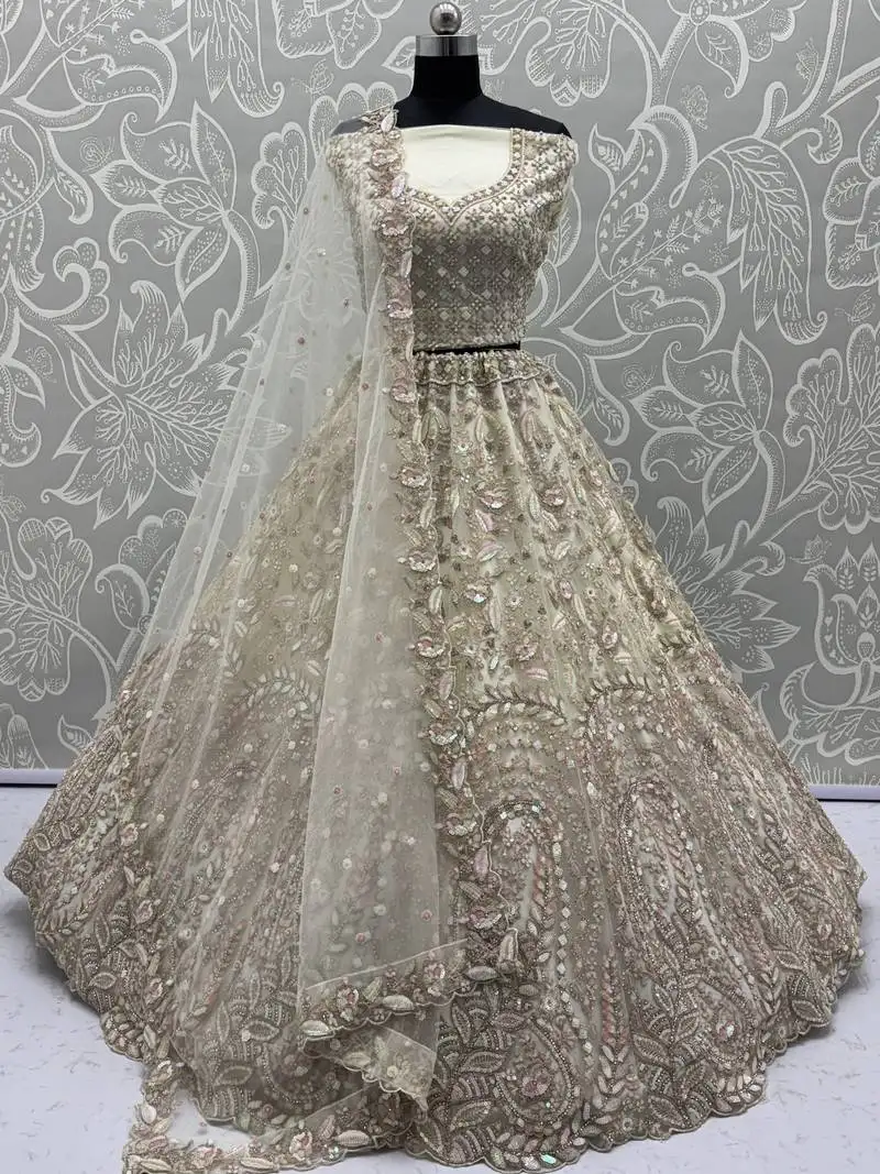Cream zircon work net bridesmaid lehenga choli with dupatta