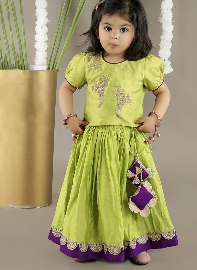Green cotton silk embroidered girls gharara paired with blouse