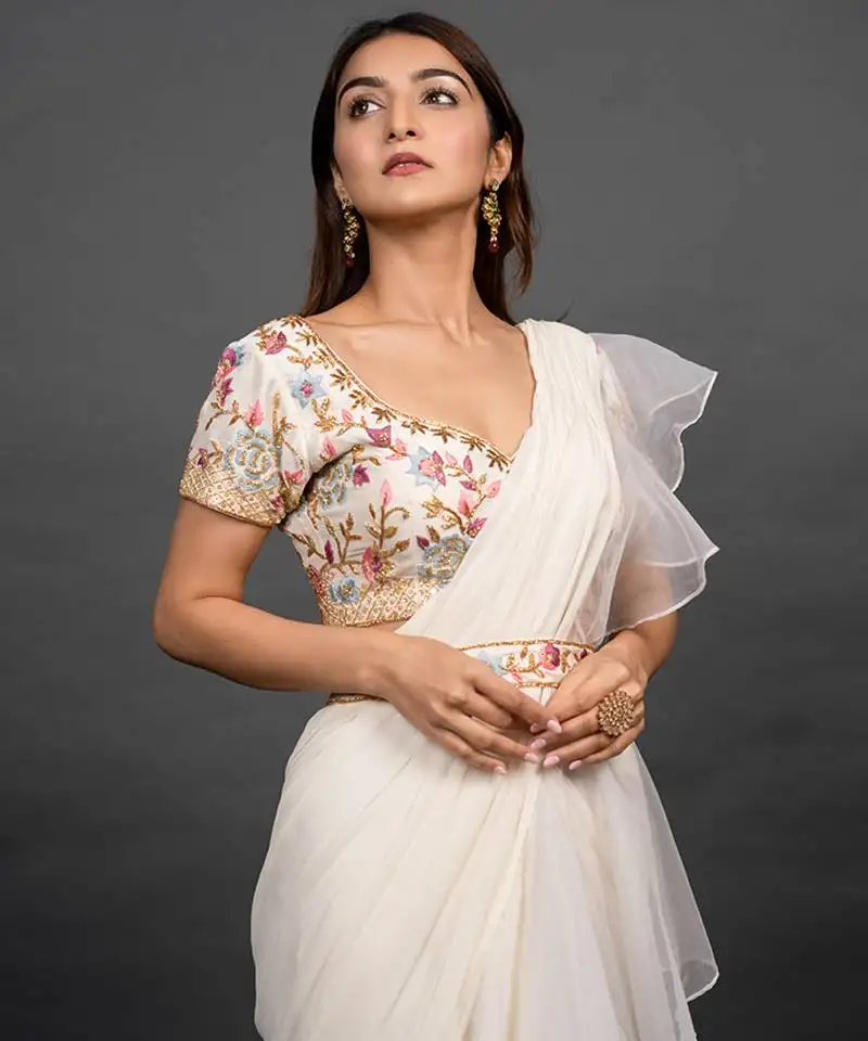 White organza plain saree with embroidered blouse & belt