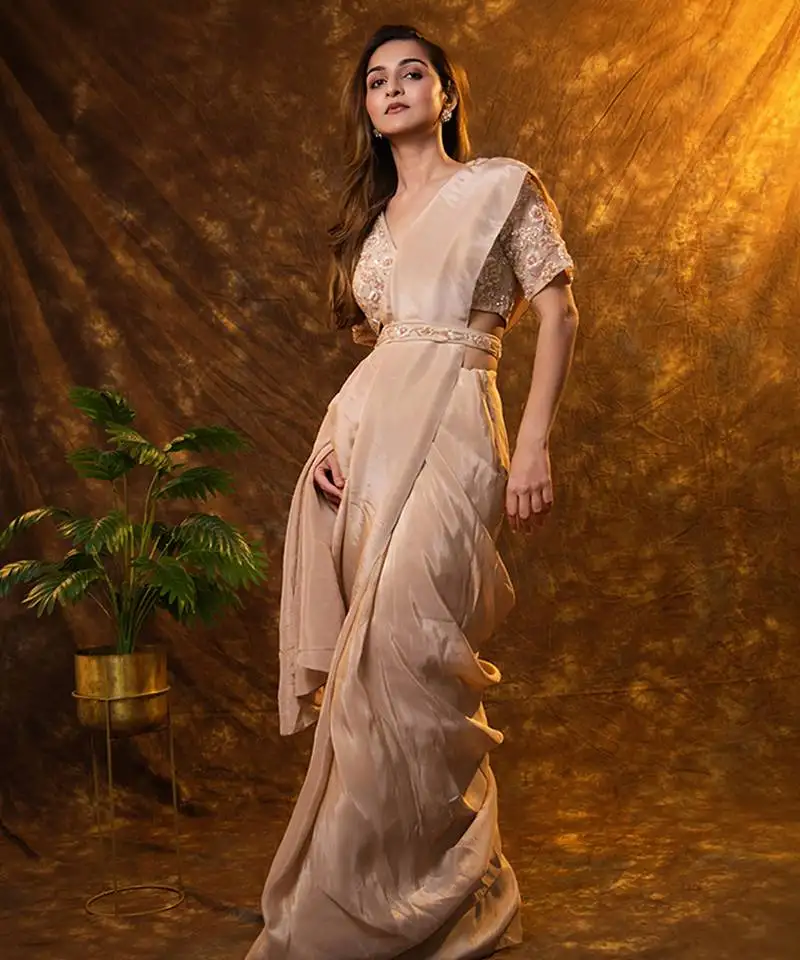 Beige tissue plain saree with embroidered blouse & belt