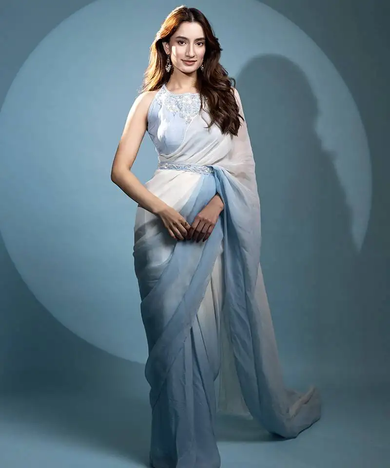 Light blue organza plain saree with embroidered blouse & belt