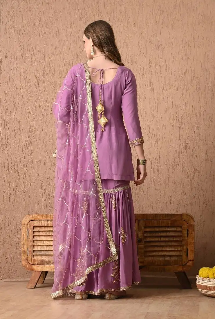Breathtaking purple sharara set with zardozi and sequins work