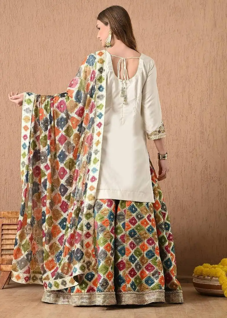 Cream lehnga set with gotta zardozi thread and sequins work