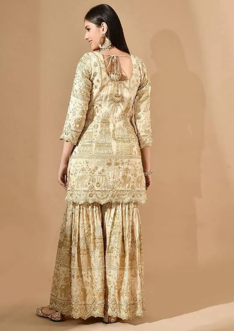 Golden sharara set with zardozi pearl & cutdana work