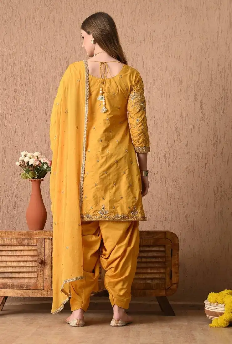 Traditional yellow kurta set with zardozi dabka sequins and tilla work
