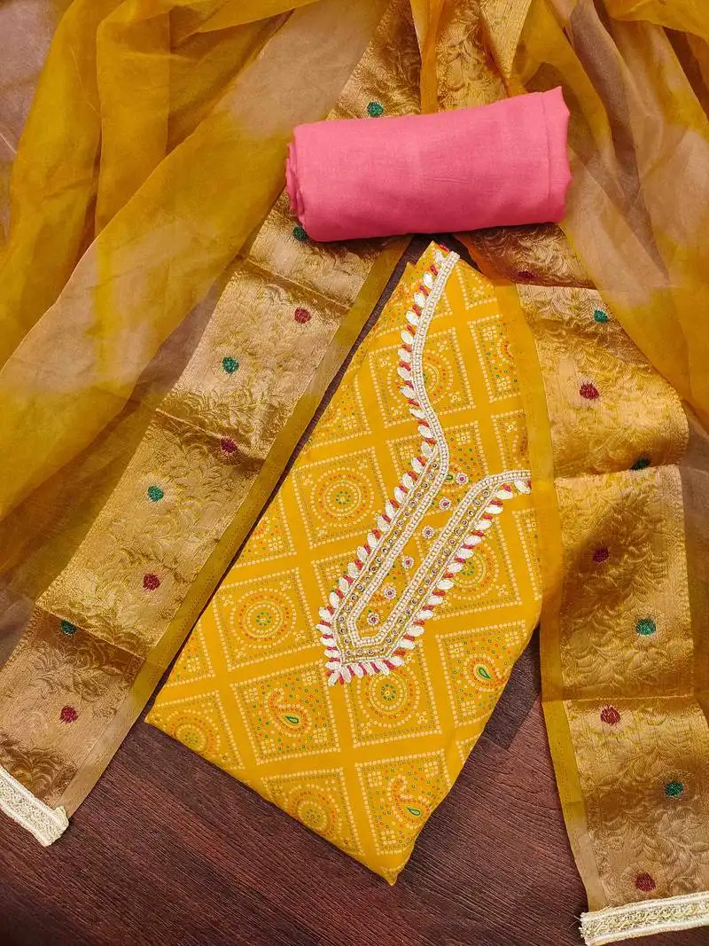 Women's yellow printed handwork dress material unstitched