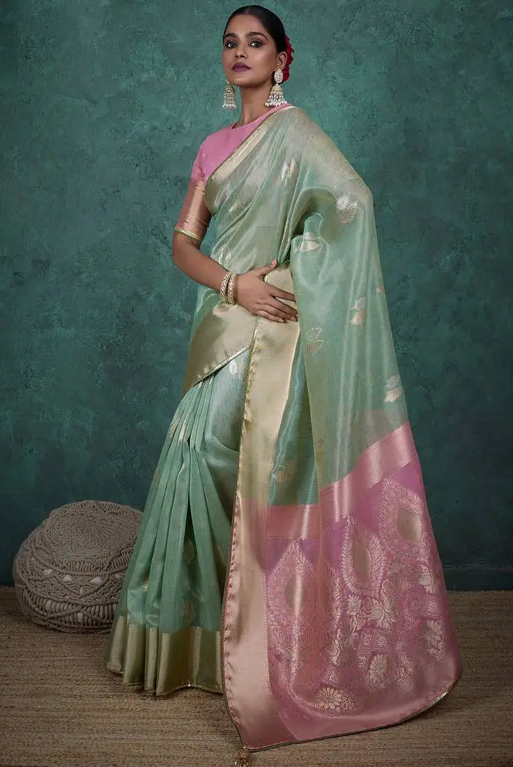 Light green linen blend self woven butta all over, a grand broad patta & sequins woven pallu saree with blouse