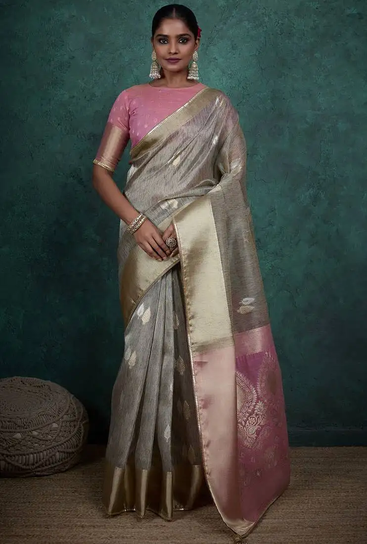 Grey linen blend self woven butta all over, a grand broad patta & sequins woven pallu saree with blouse