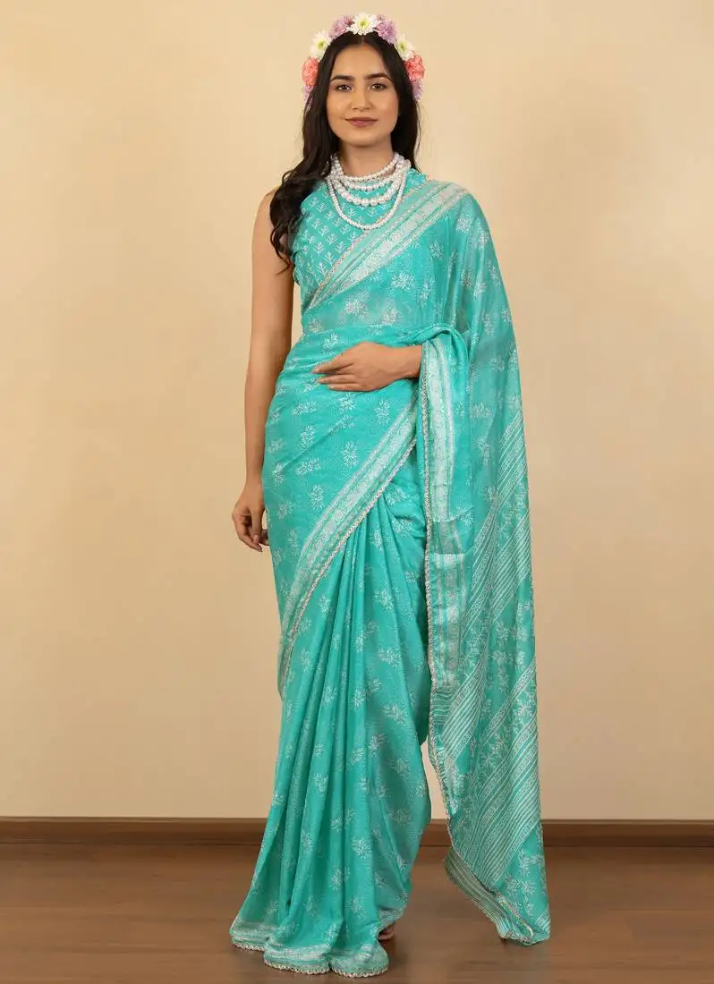 Light turquoise chiffon floral print zari work golden lace saree with unstitched blouse piece