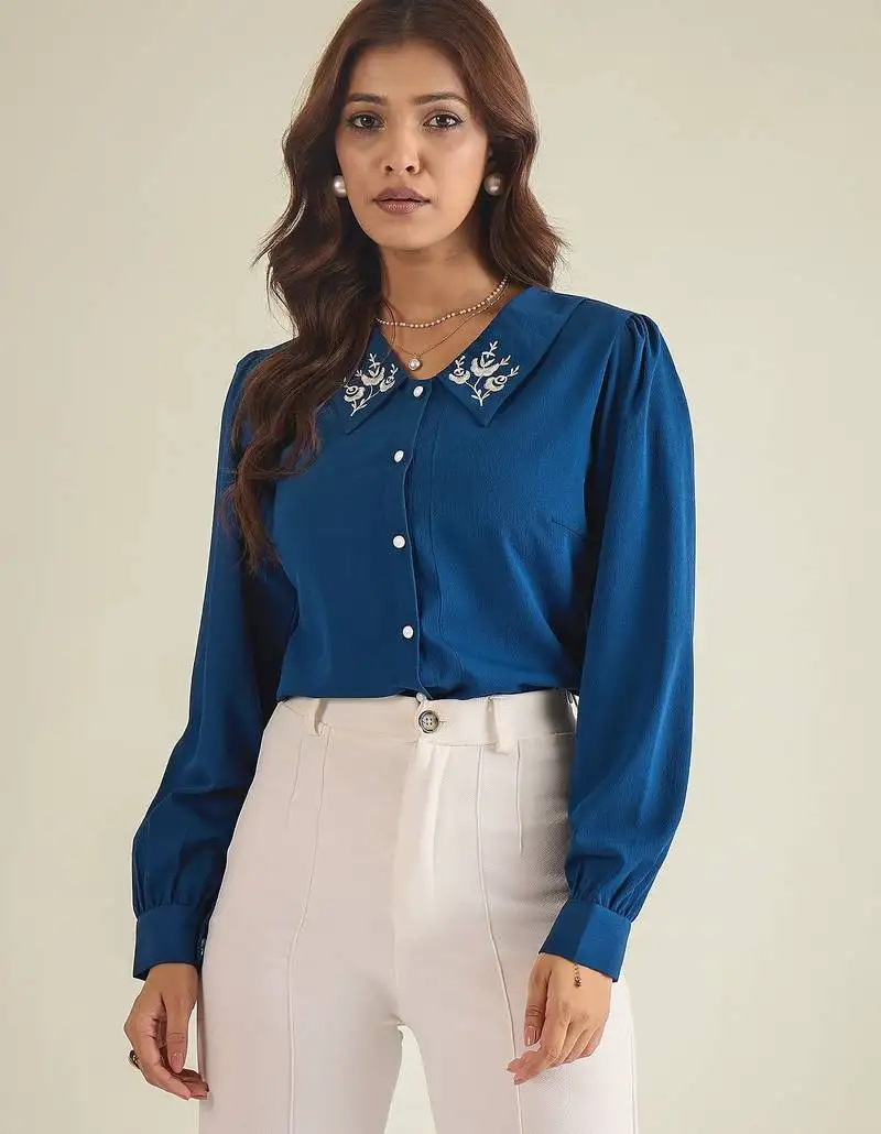 Blue collared shirt with contrast embriodery