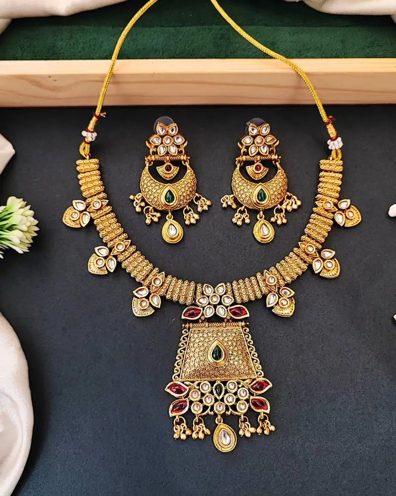 Indian style kundan necklace set with earrings, gold-plated with green and red stones for her