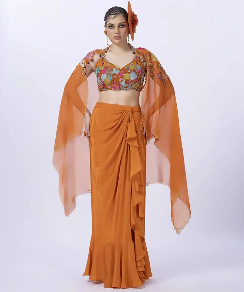 Orange embroidered organza blouse paired with dhoti & shrug