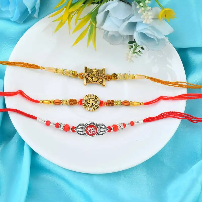 Rakhi for bhaiya bhabhi-brass gold plated, pure silver and swastik rakhi for rakshabandhan (pack of 3)