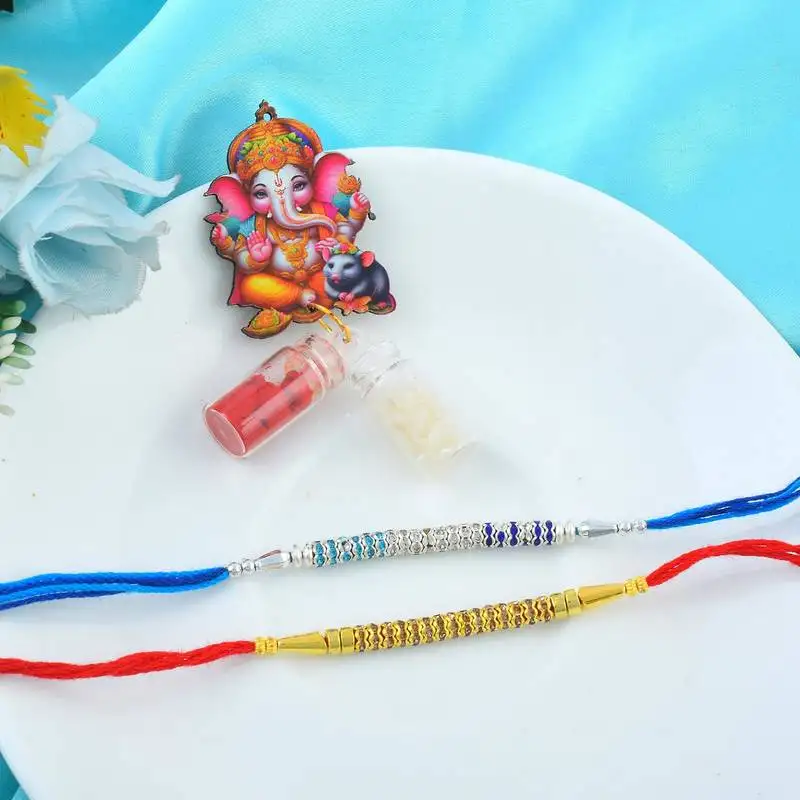 Rakhi for bhaiya bhabhi- imitation diamond rakhi with 50% silver content lakshmi ganesh coin (pack of 2)