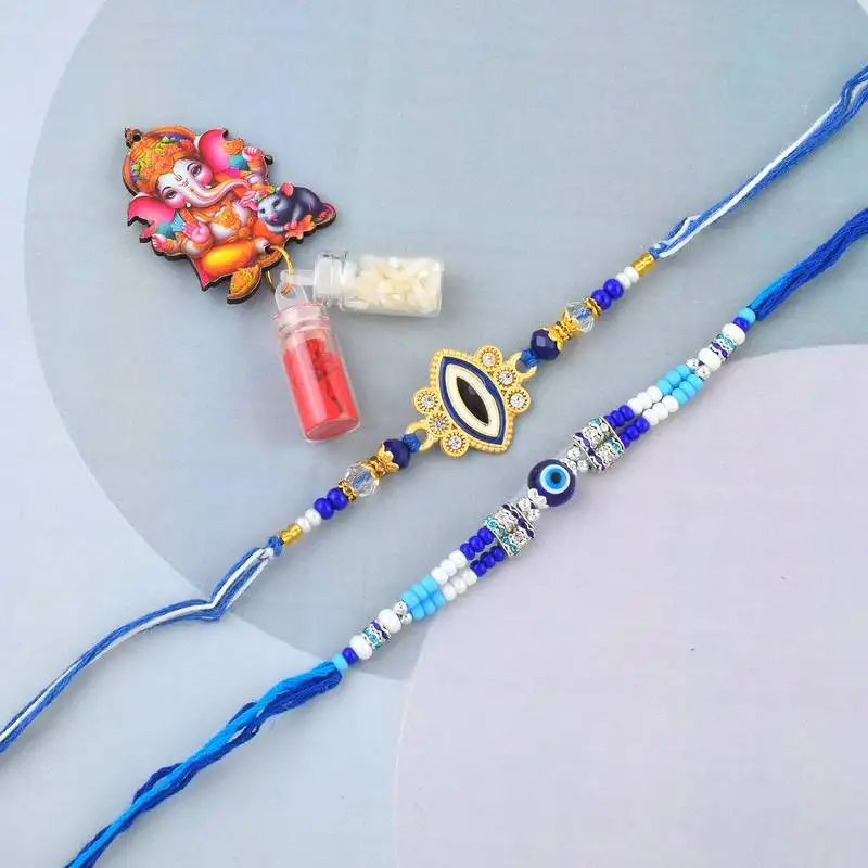 Ceramic evil eye combo rakhi for bhaiya bhabhi with 50% silver content lakshmi ganesh coin (pack of 2)