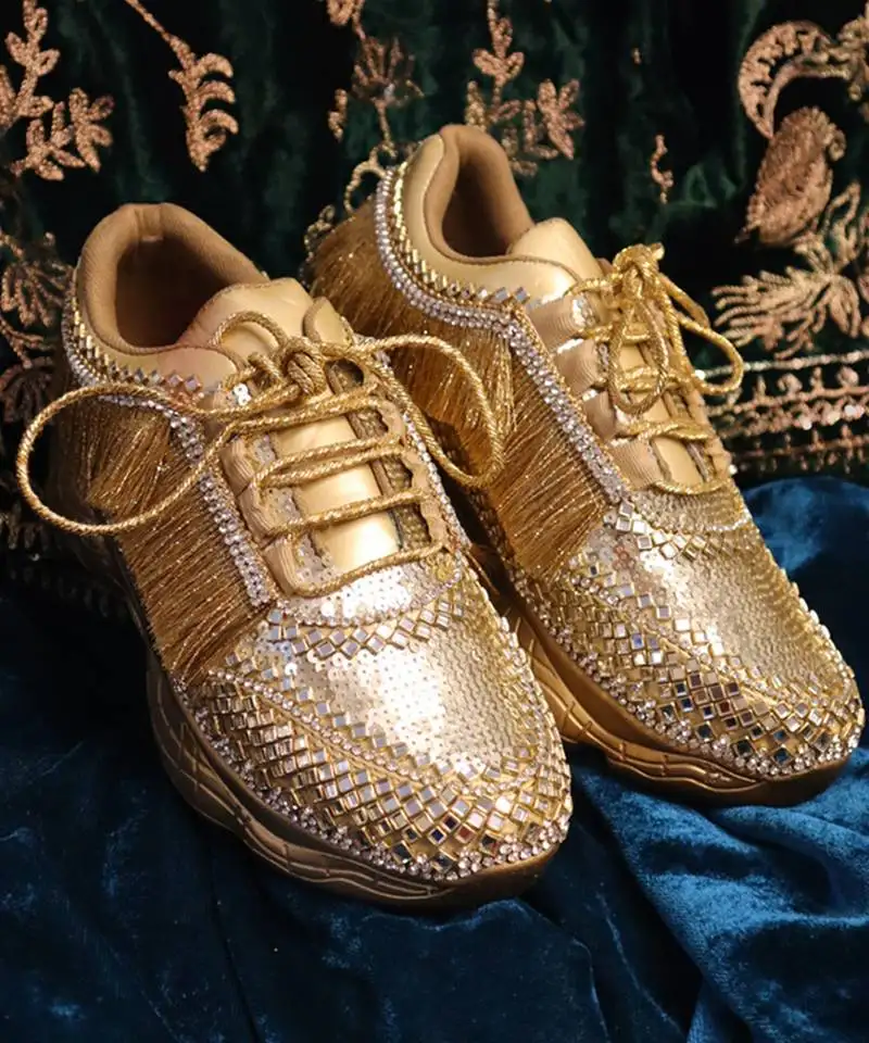 Gold leather embroidered sneakers