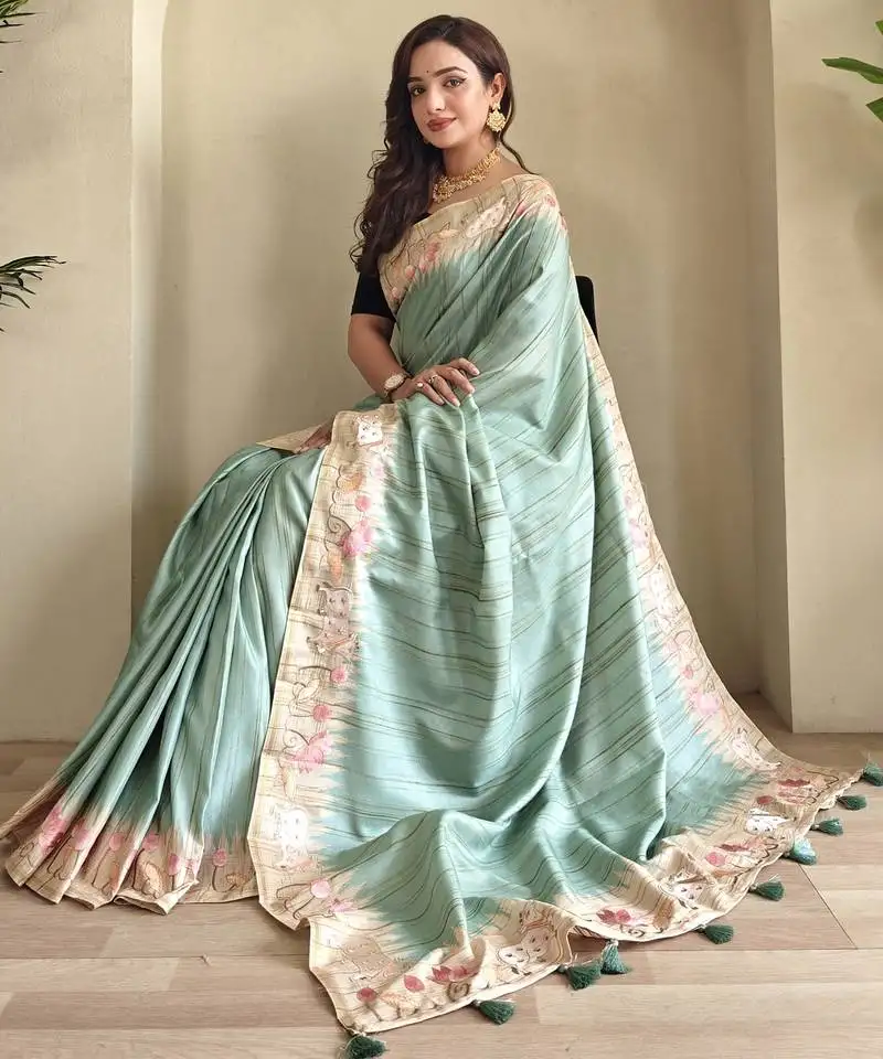 Sea green tussar saree with pichwai style embroidery