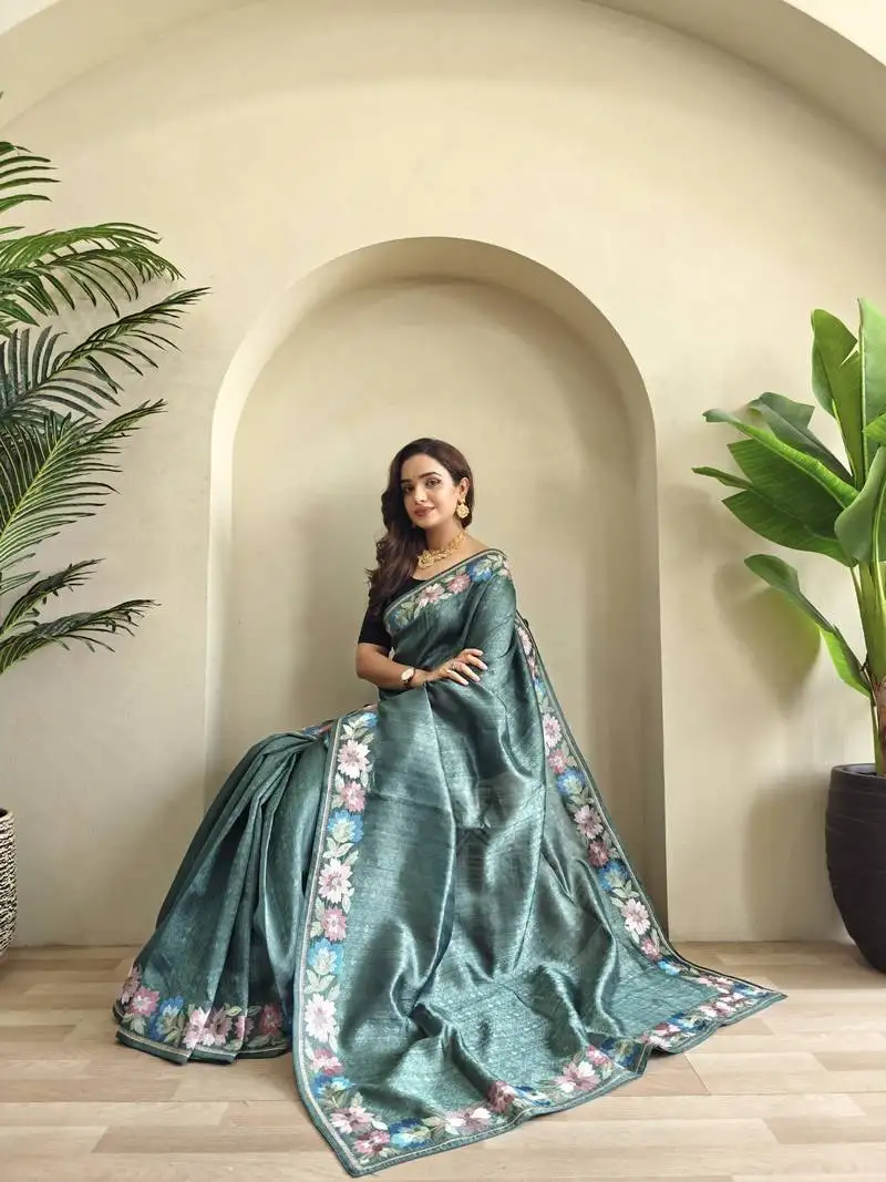 Sea green tussar saree with contrast embroidery