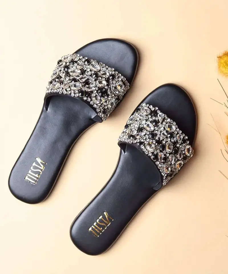 Black embroidered leather flats