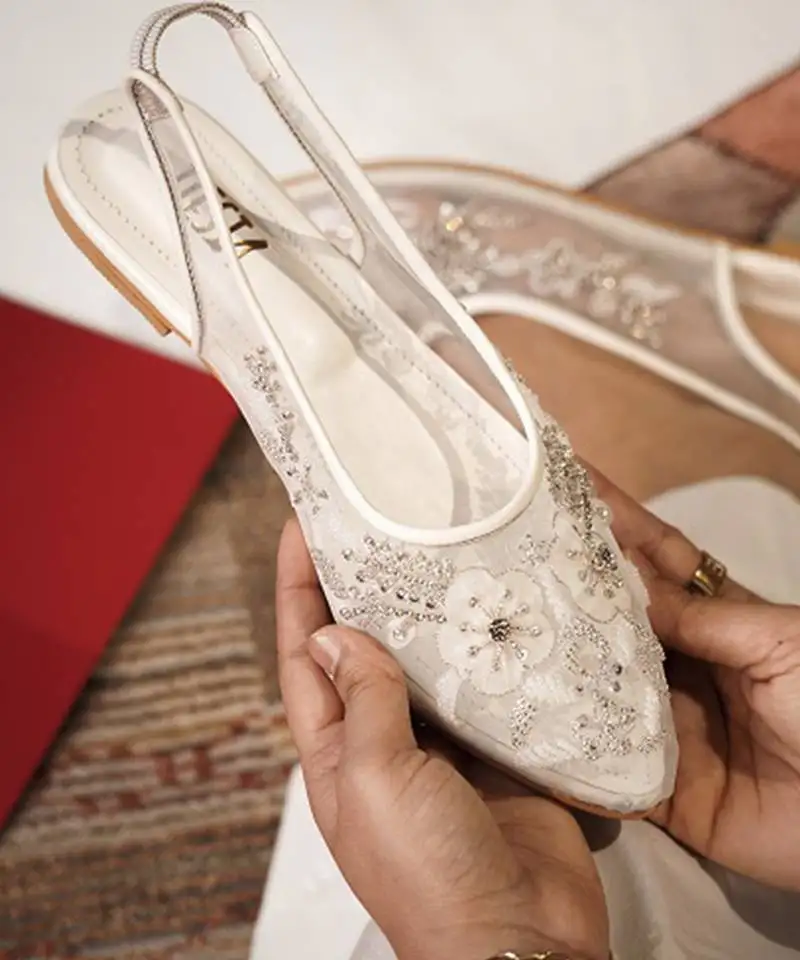 White embroidered leather flats