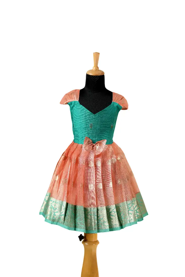 Girls peach floating mango butta pattu pavadai frocks