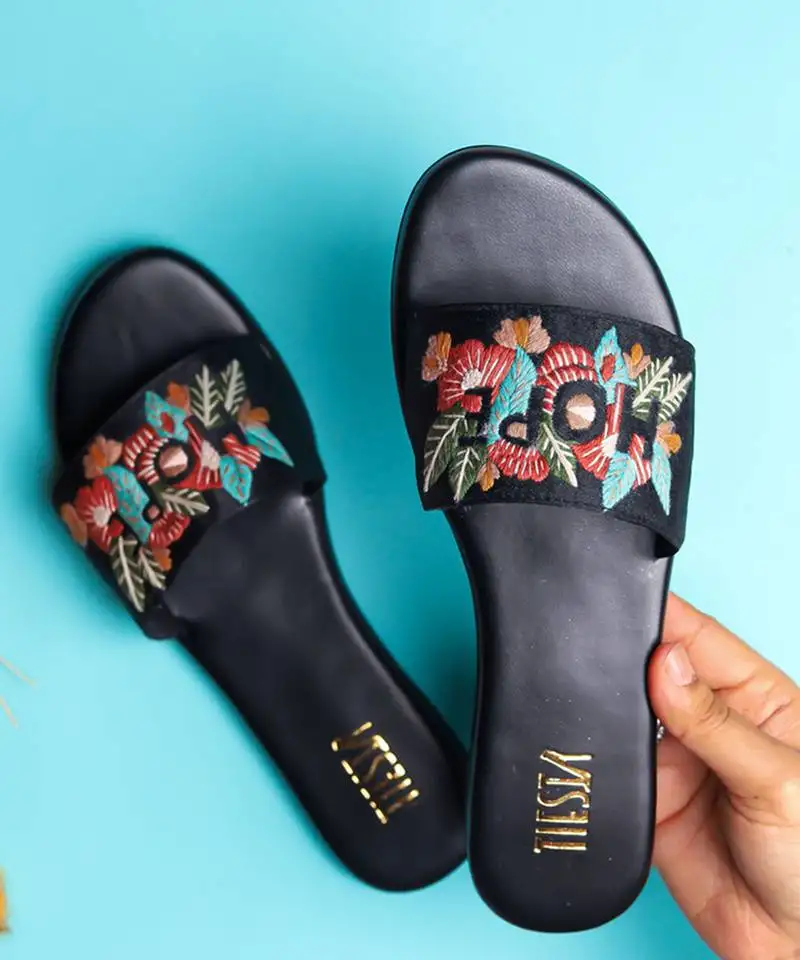 Black embroidered synthetic leather flats