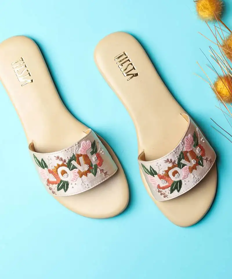 Beige embroidered synthetic leather flats