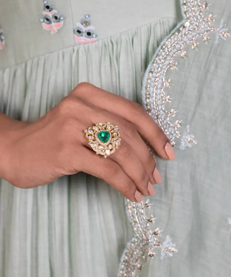 Yellow gold plated ring with green stone