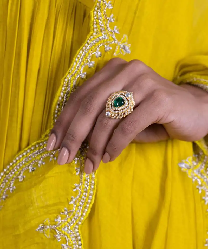 Yellow gold plated silver sterling ring with green stone