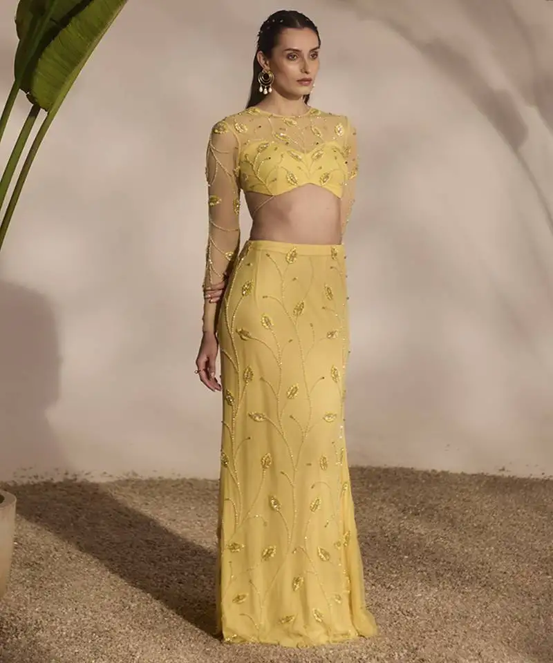 Yellow embroidered net lehenga with blouse