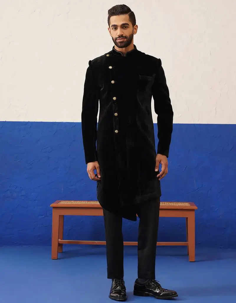 Rishabh chawla in black velvet asymmetric indowestern