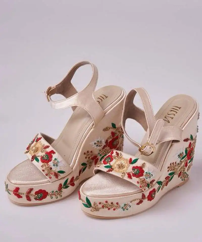 Gold woven leather wedges