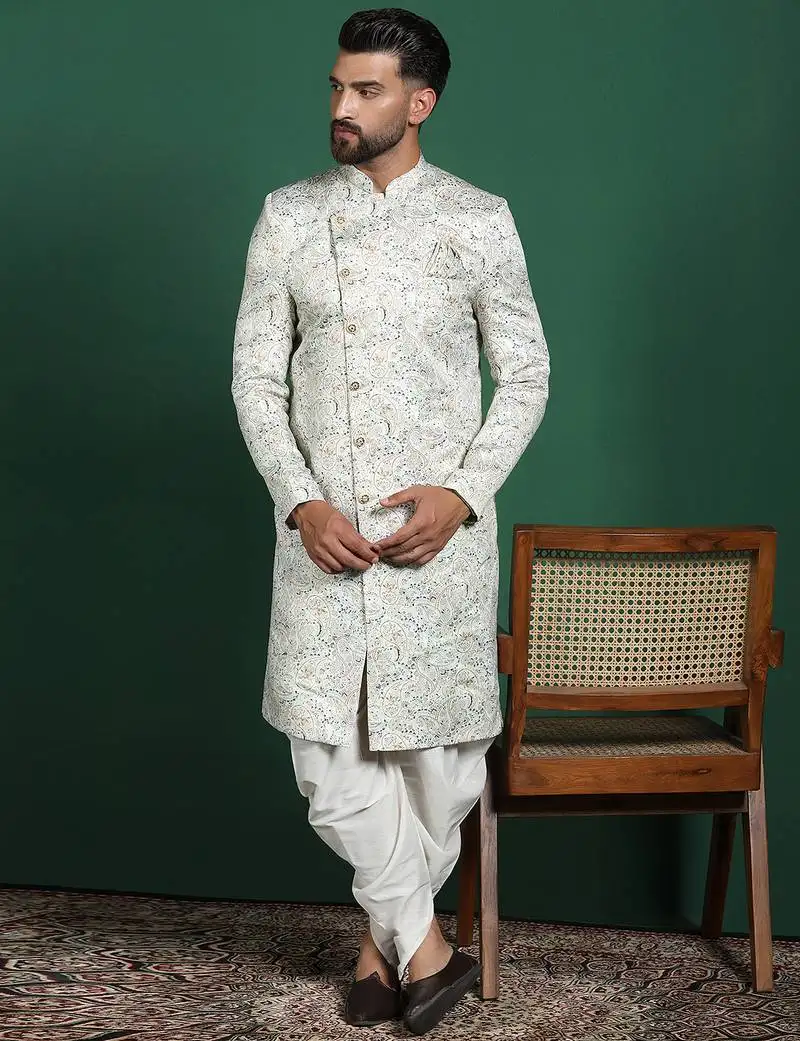 Cream sherwani dhoti set with paisley design   subtle indian groom outfit