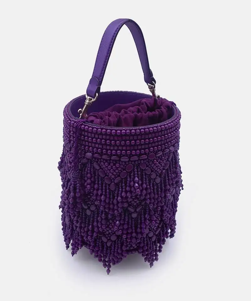 Handcrafted purple potli bag adorned with intricate bead embellished