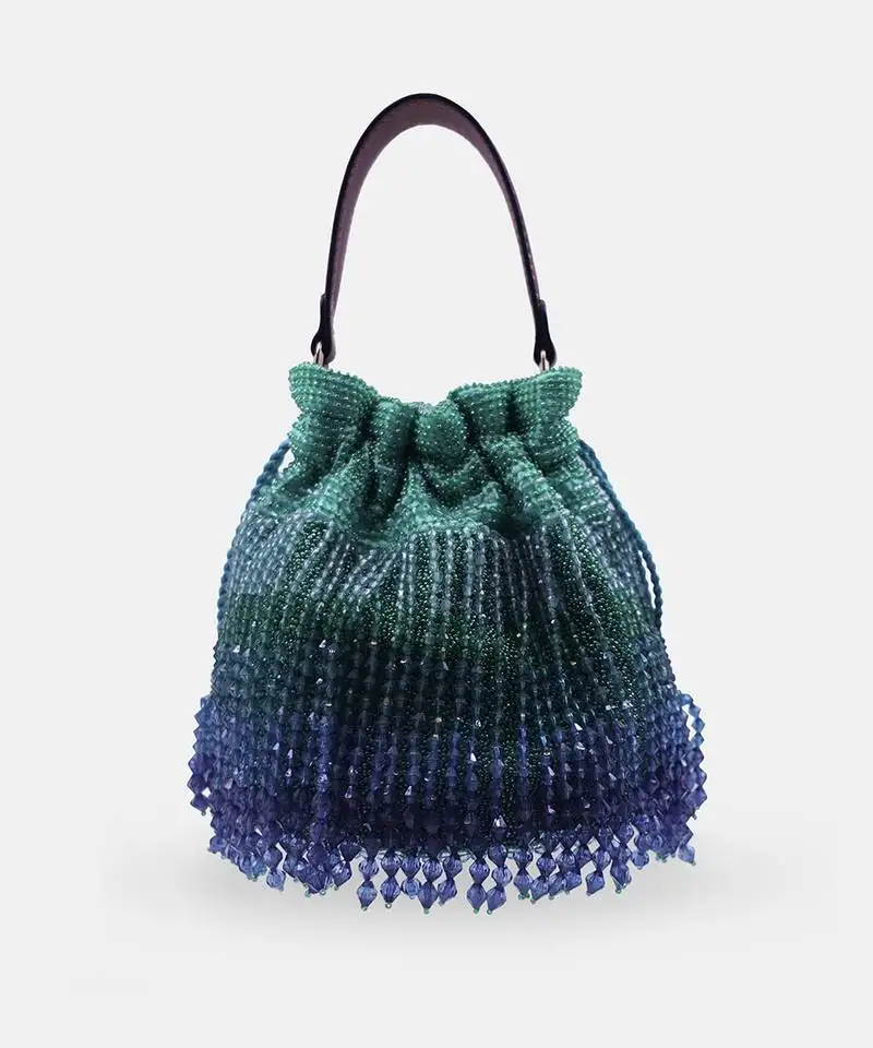Emerald green potli bag embellished with crystal fringes and a drawstring