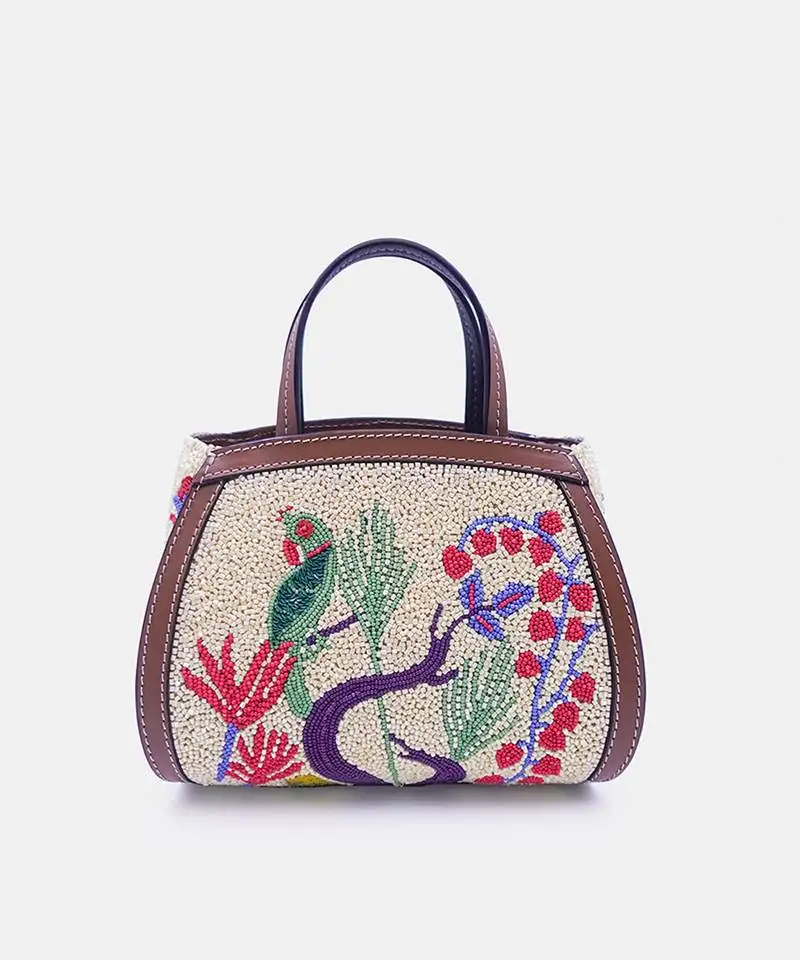 Multi color bead-embellished clutch bag with crossbody strap.