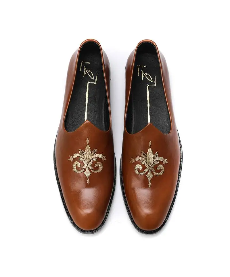 Tan napa leather finish mojadi with embroidered centre motif