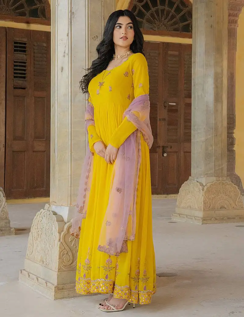 Yellow georgette gown with lilac net dupatta & embroidery stitched