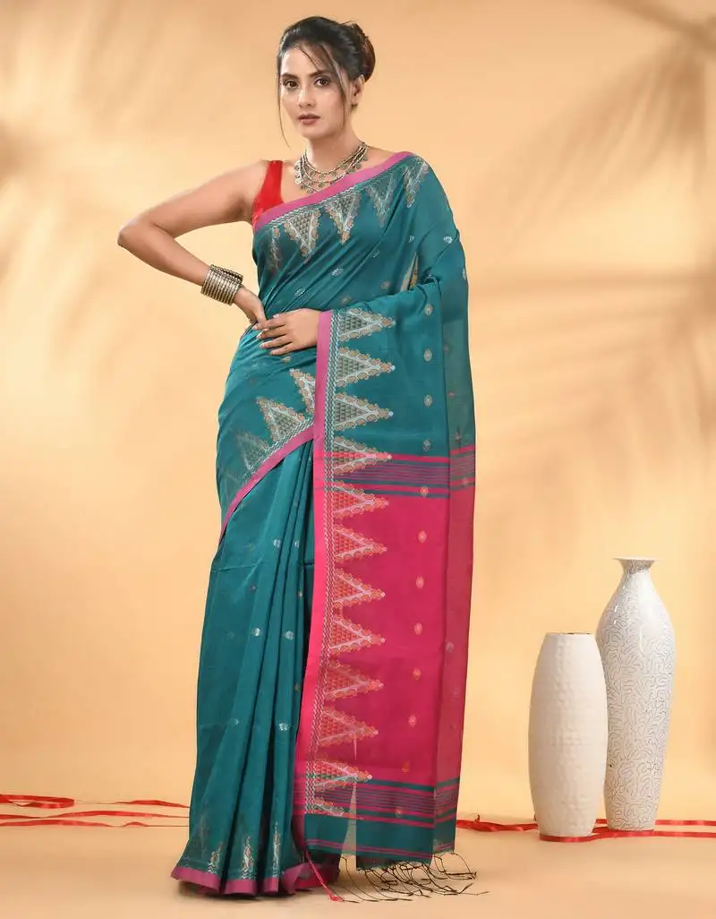 Teal and pink cotton blend saree with ethnic motifs
